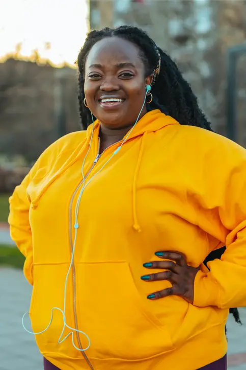 black woman in orange jacket working out in new braunfels, texas